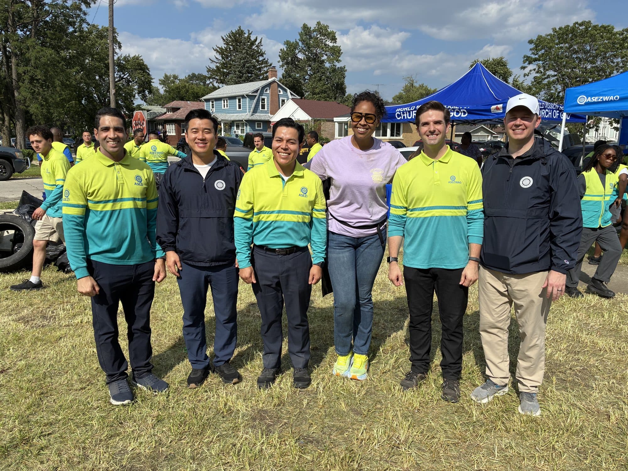 Colby Chapman with neighbors at a community cleanup