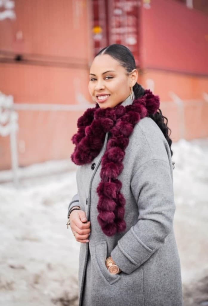 Colby Chapman in a gray coat and burgundy scarf