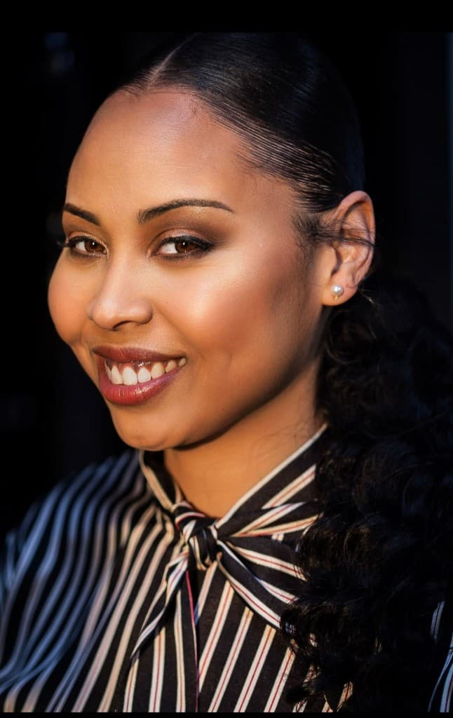 Close portrait of Colby Chapman in a striped blouse
